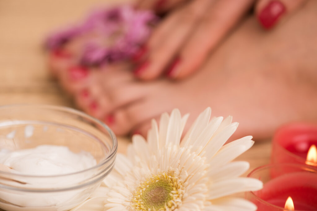 female feet and hands at spa salon